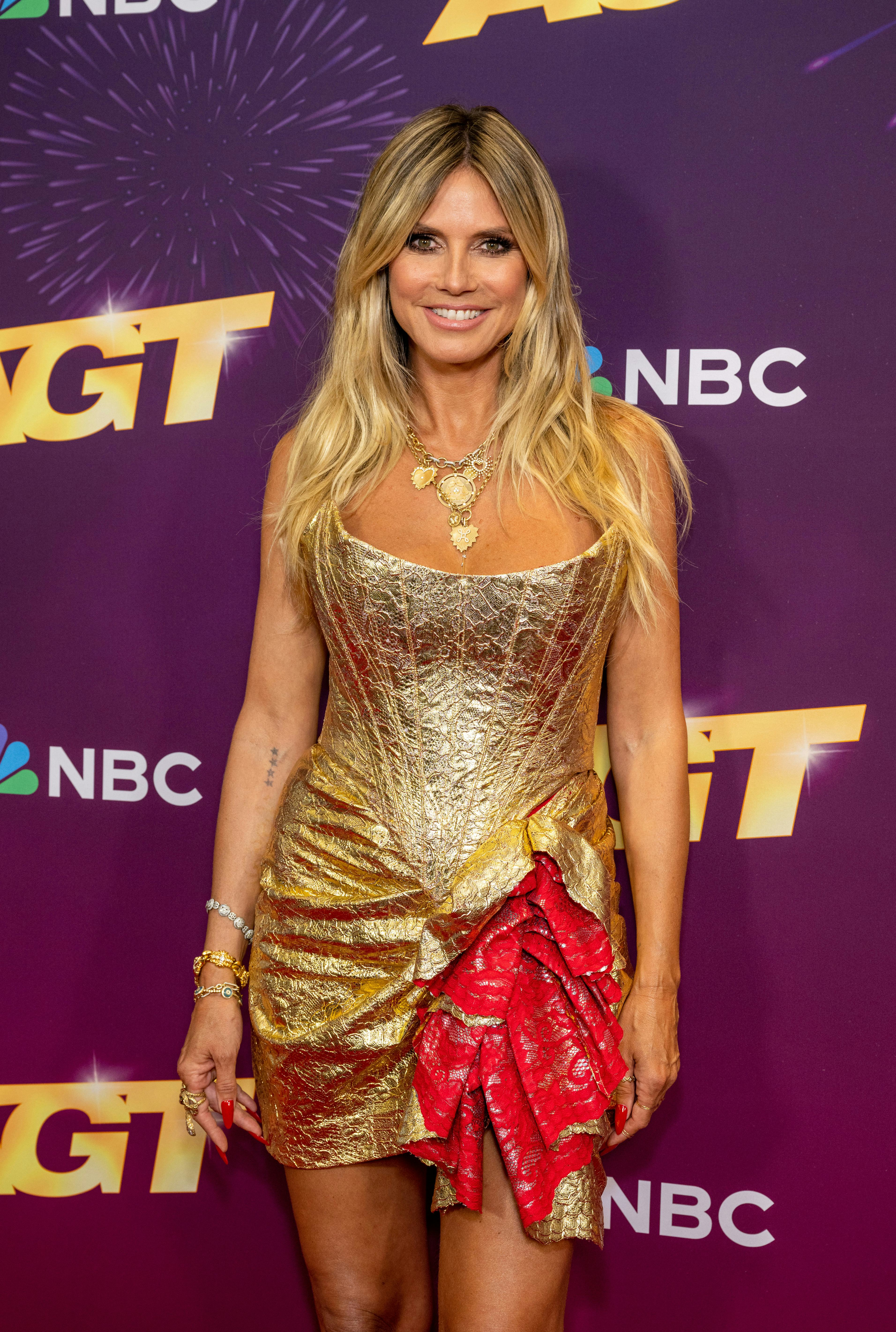 Heidi Klum wears a strapless gold bustier dress to attend the &ldquo;America&rsquo;s Got Talent&rdquo; Season 19 Quart&hellip;