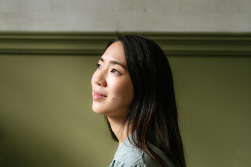 Portrait of a young Japanese woman.  Studio shot, close up.