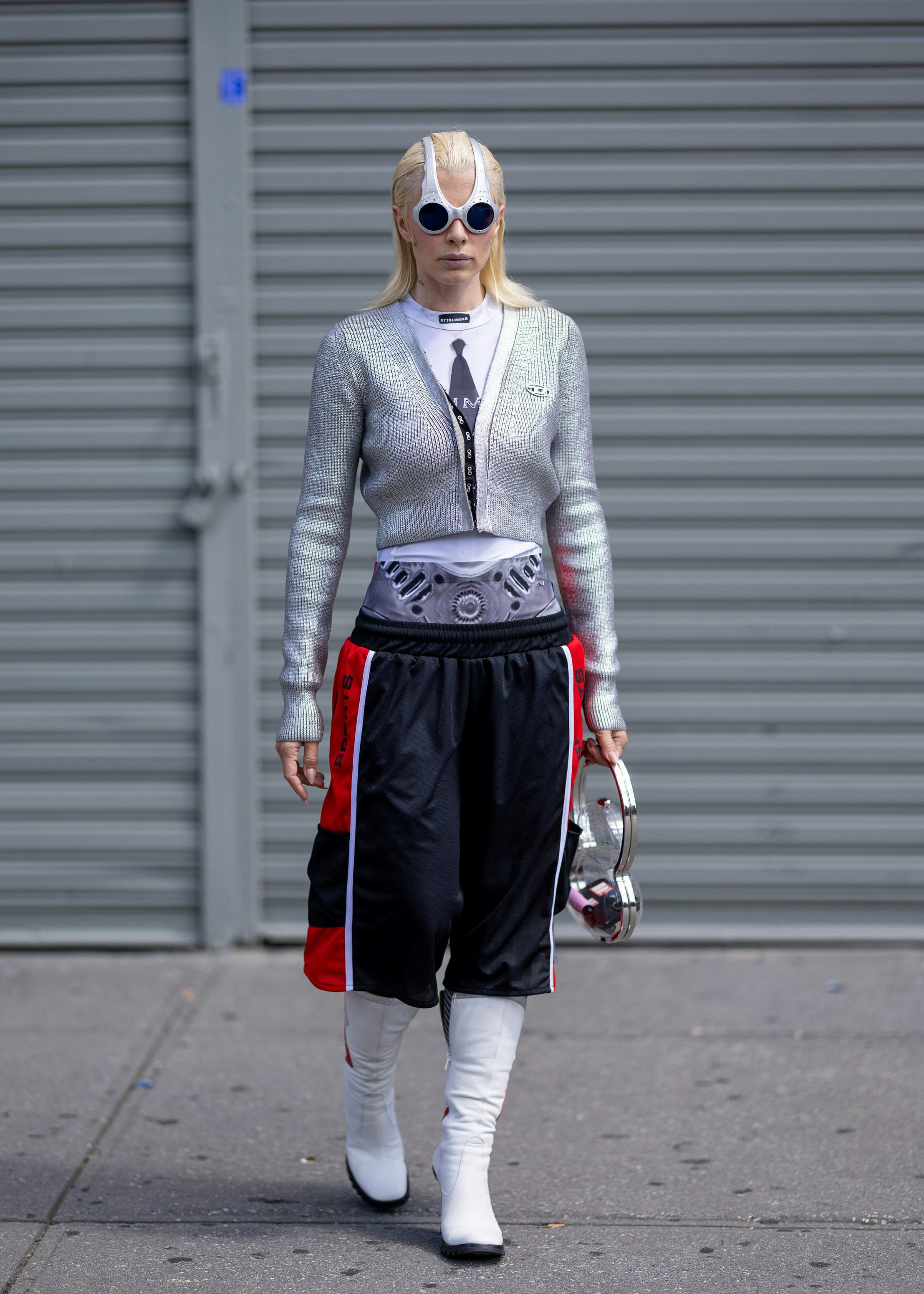 Julia Fox wears a silver sweater, jersey shorts, and white boots on August 13, 2024 in New York City&hellip;