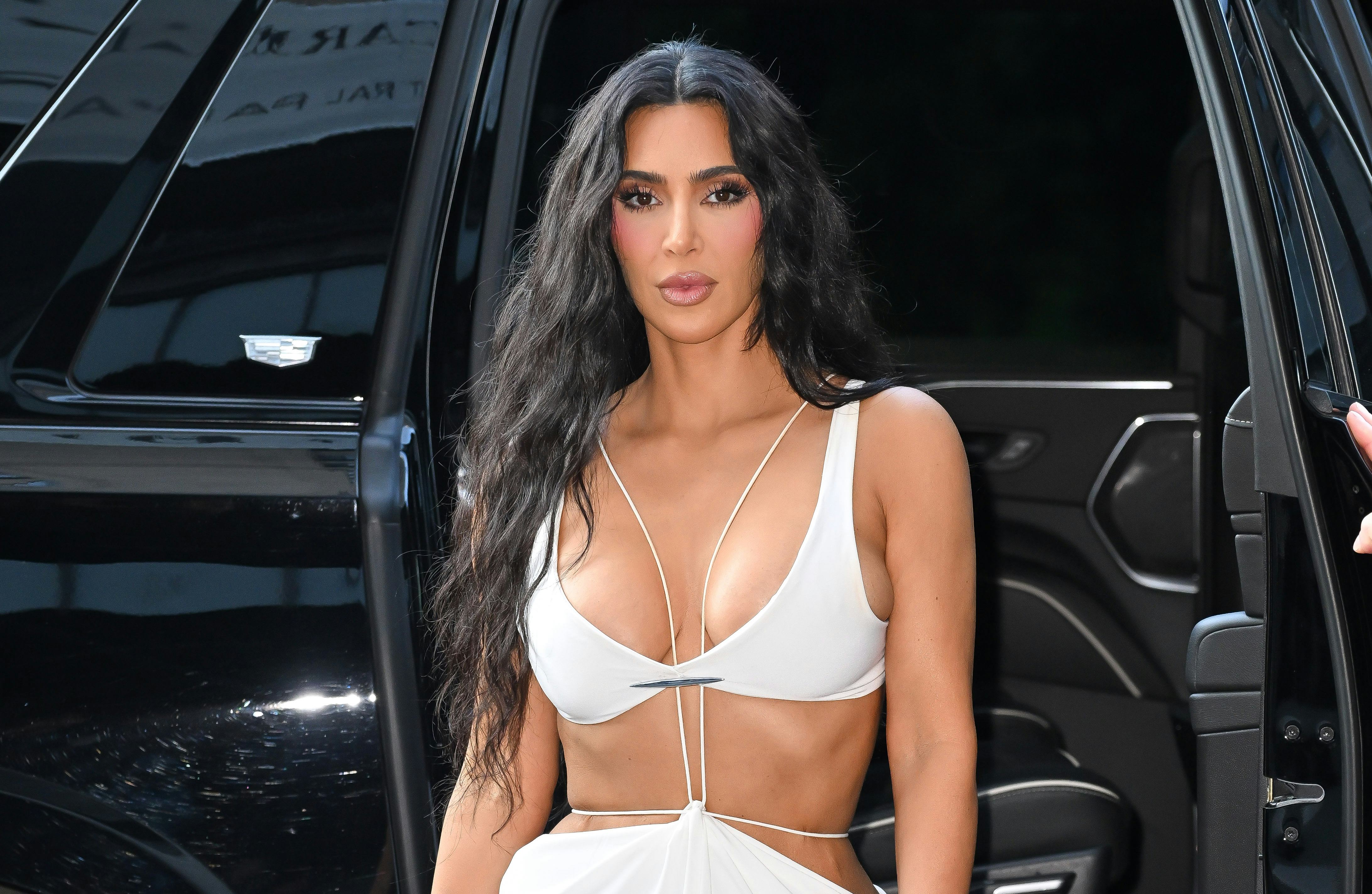 Kim Kardashian is seen in an all-white bra-and-skirt ensemble on August 14, 2024 in New York City.
