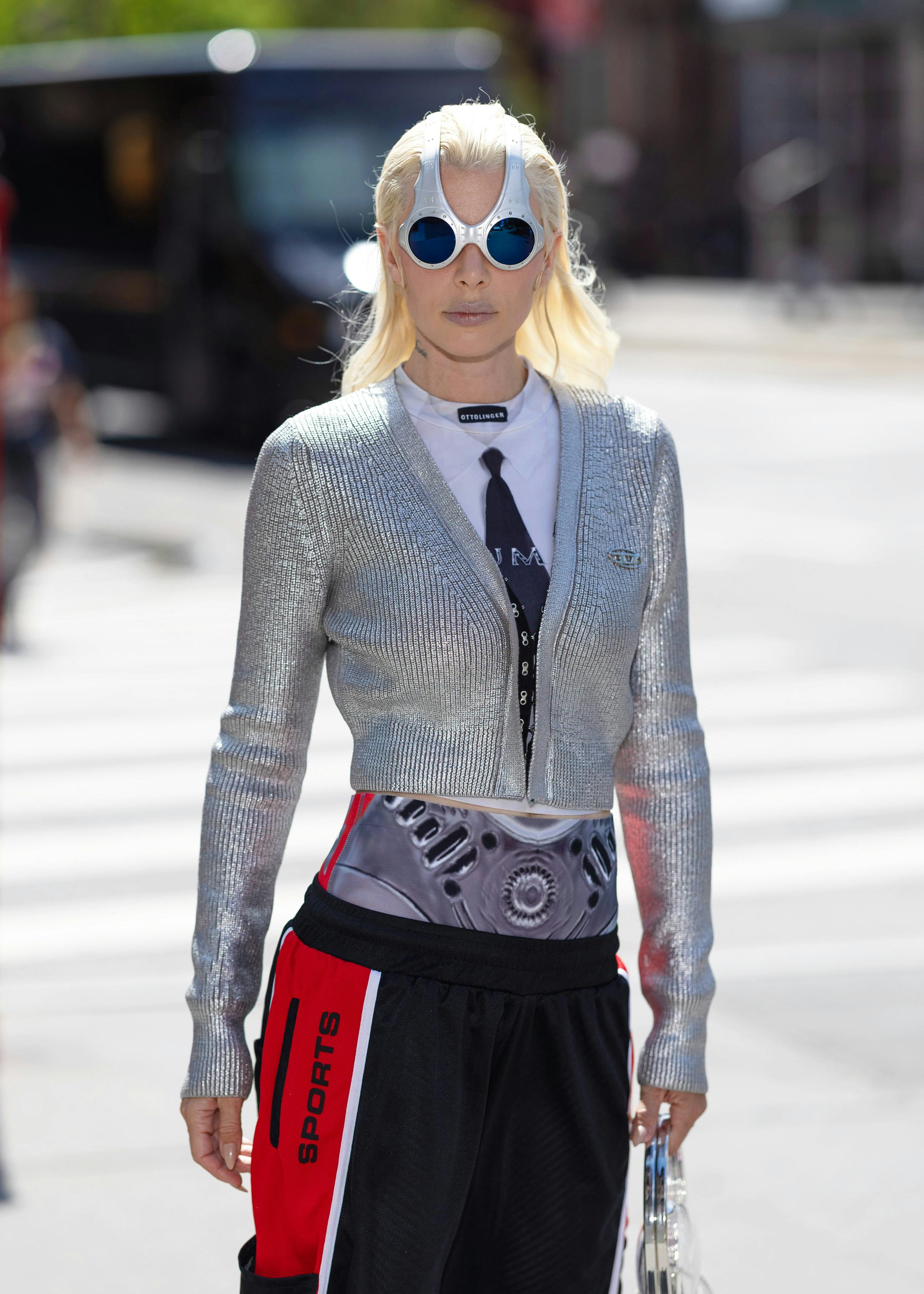 Julia Fox wears a silver sweater, jersey shorts, and white boots on August 13, 2024 in New York City&hellip;