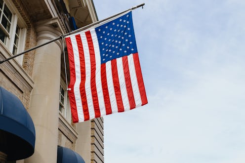 Close-up of American flag hanging from building
