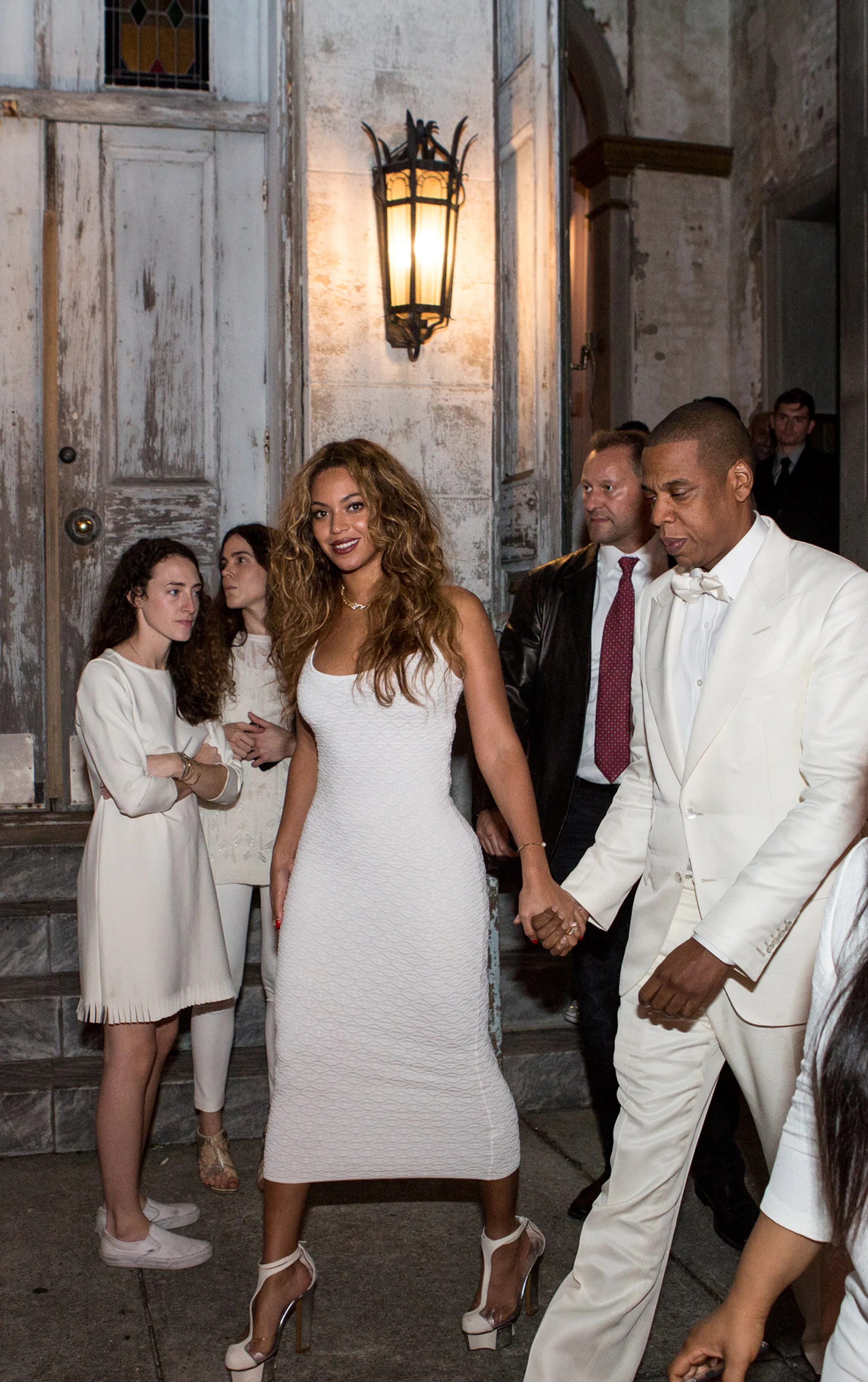 Beyoncé Wore A Plunging White Minidress & Ruffled Headpiece To A Wedding