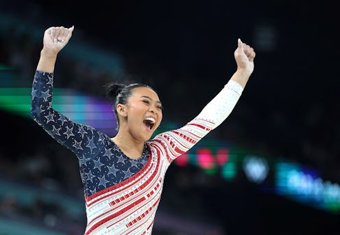 Sunisa Lee of the United States celebrates after the balance beam event of the artistic gymnastics w...