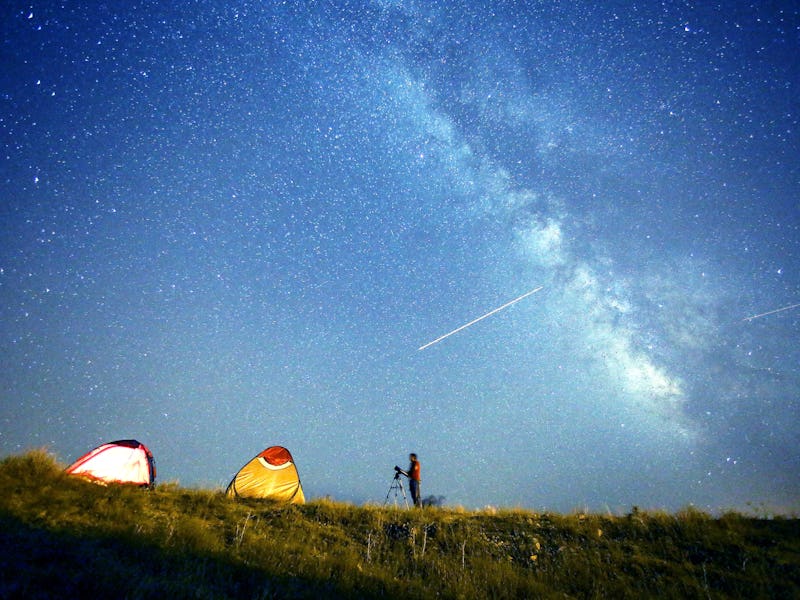 Perseid meteors streak across the sky during the annual Perseid meteor shower in Edremit district of...