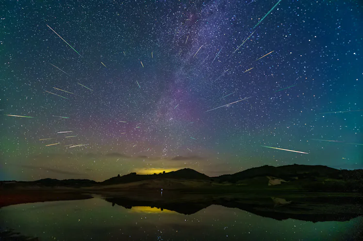 CHIFENG, CHINA - AUGUST 14, 2023 - The Perseid meteor shower is seen over the Ulanbum grassland in C...