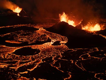 GRINDAVIK, ICELAND - JUNE 3: Seen from an aerial view, lava spews from multiple craters of the Sundh...