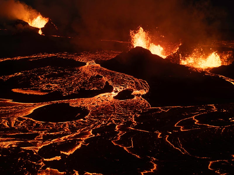 GRINDAVIK, ICELAND - JUNE 3: Seen from an aerial view, lava spews from multiple craters of the Sundh...
