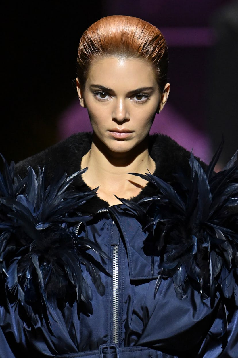 Kendall Jenner debuted copper hair at the Prada Ready to Wear Fall/Winter 2022-2023 fashion show.