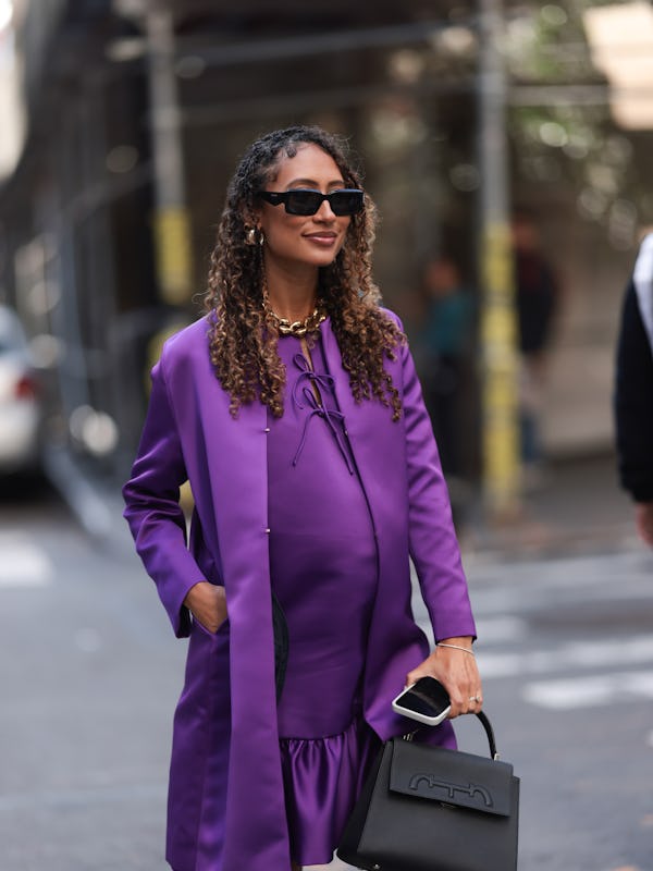 NEW YORK, NEW YORK - SEPTEMBER 09: A guest seen wearing black sunglasses, silver hoop earrings, gold…
