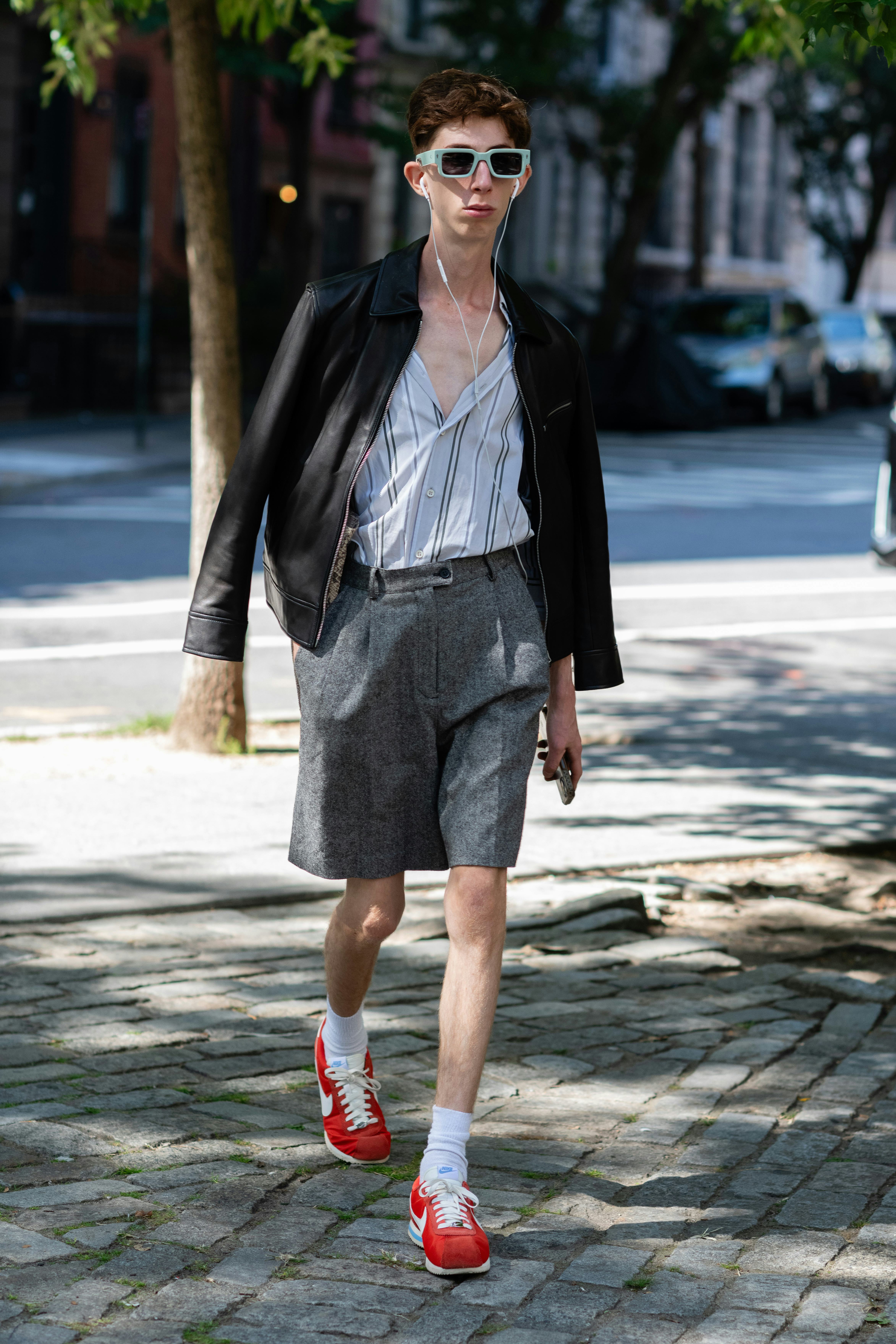 NEW YORK, NEW YORK - SEPTEMBER 11: A guest is seen wearing a black jacket, blue striped shirt, grey &hellip;