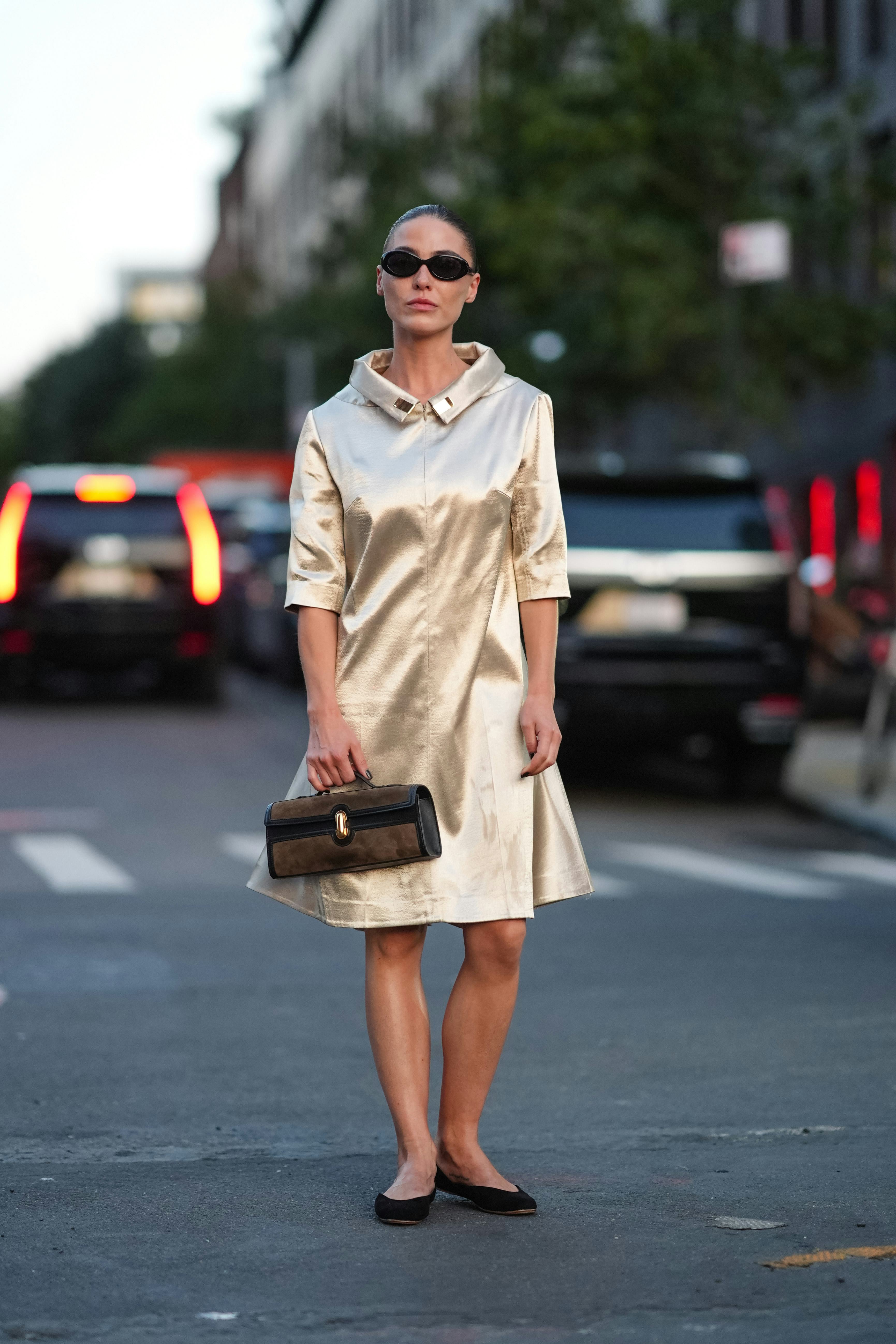 NEW YORK, NEW YORK - SEPTEMBER 09: Sophia Roe wears black sunglasses, shiny gold satin short sleeve &hellip;