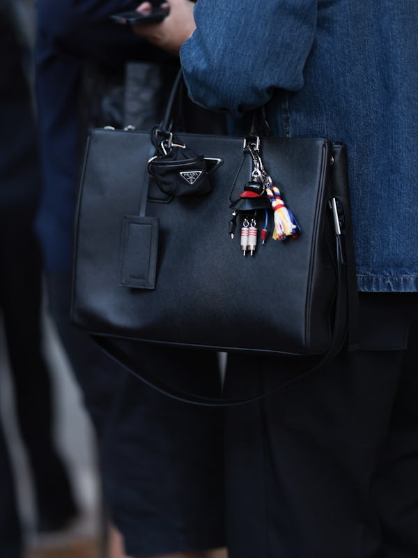 NEW YORK, NEW YORK - SEPTEMBER 05: A Fashion Week guest seen wearing blue denim shirt, black long pa…