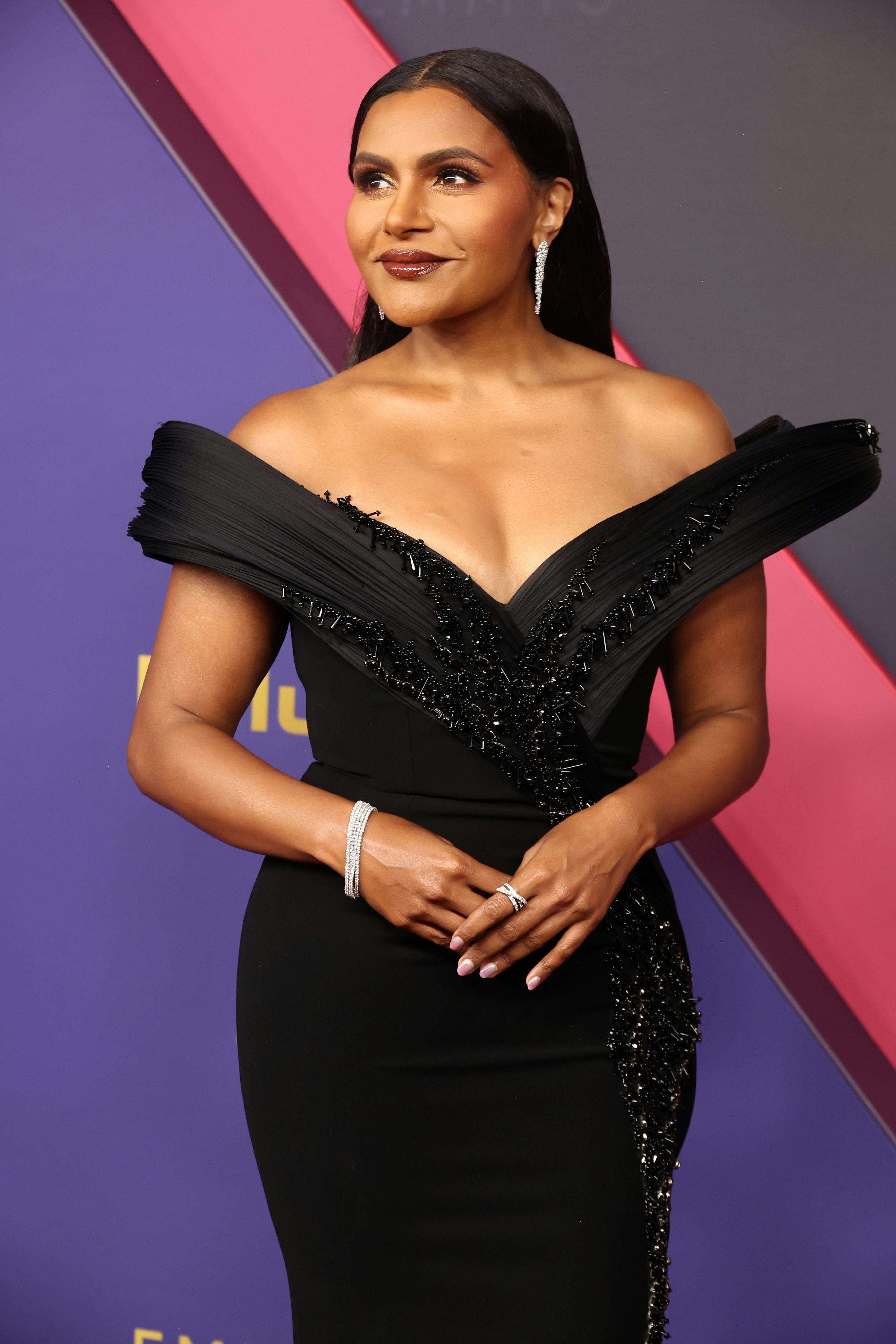 Mindy Kaling wore chocolate-toned brown lip gloss to the 2024 Emmy Awards.