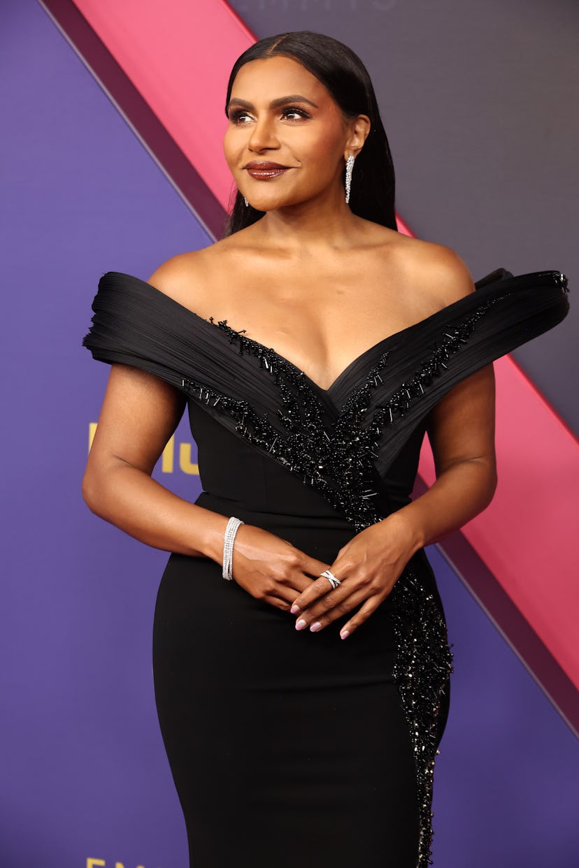 Mindy Kaling wore chocolate-toned brown lip gloss to the 2024 Emmy Awards.