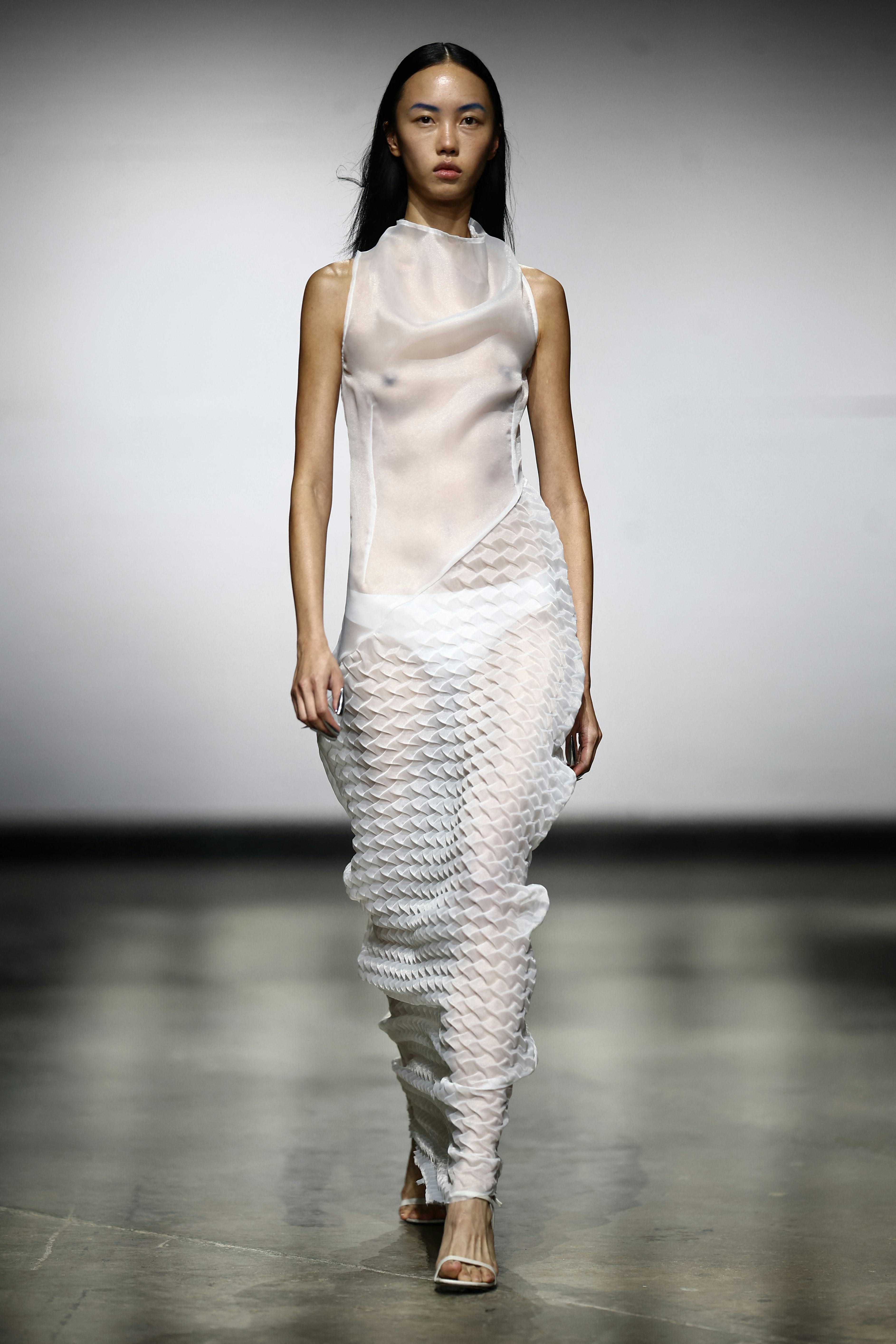 A model presents a creation during a catwalk presentation for the Chet Lo Spring/Summer 2025 collect&hellip;