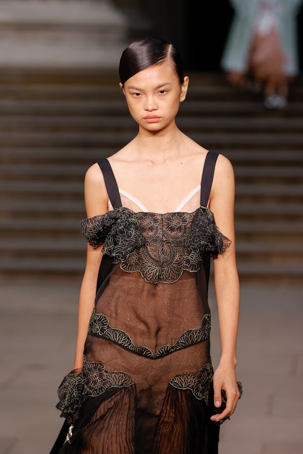 Sleek hair with deep side parts were spotted at Erdem.