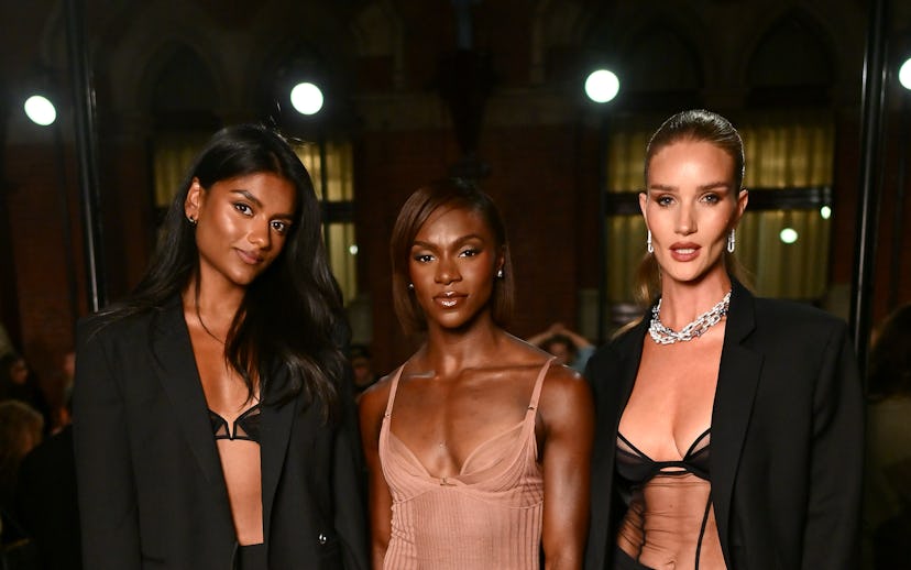 LONDON, ENGLAND - SEPTEMBER 14: (L to R) Simone Ashley, Dina Asher-Smith and Rosie Huntington-Whitel...