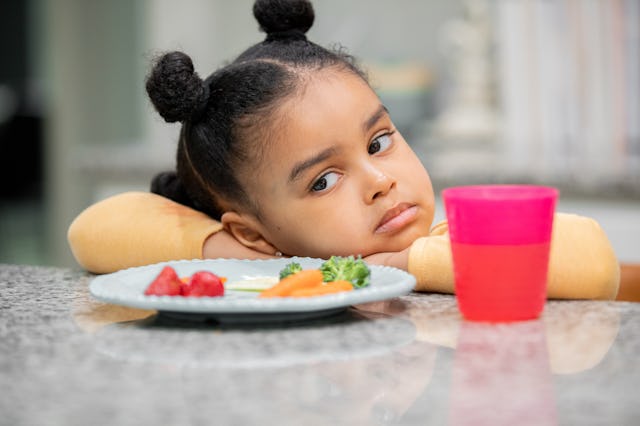 Upset toddler refuses to eat healthy meal because she is a picky eater. Genetics, and at a lesser le...