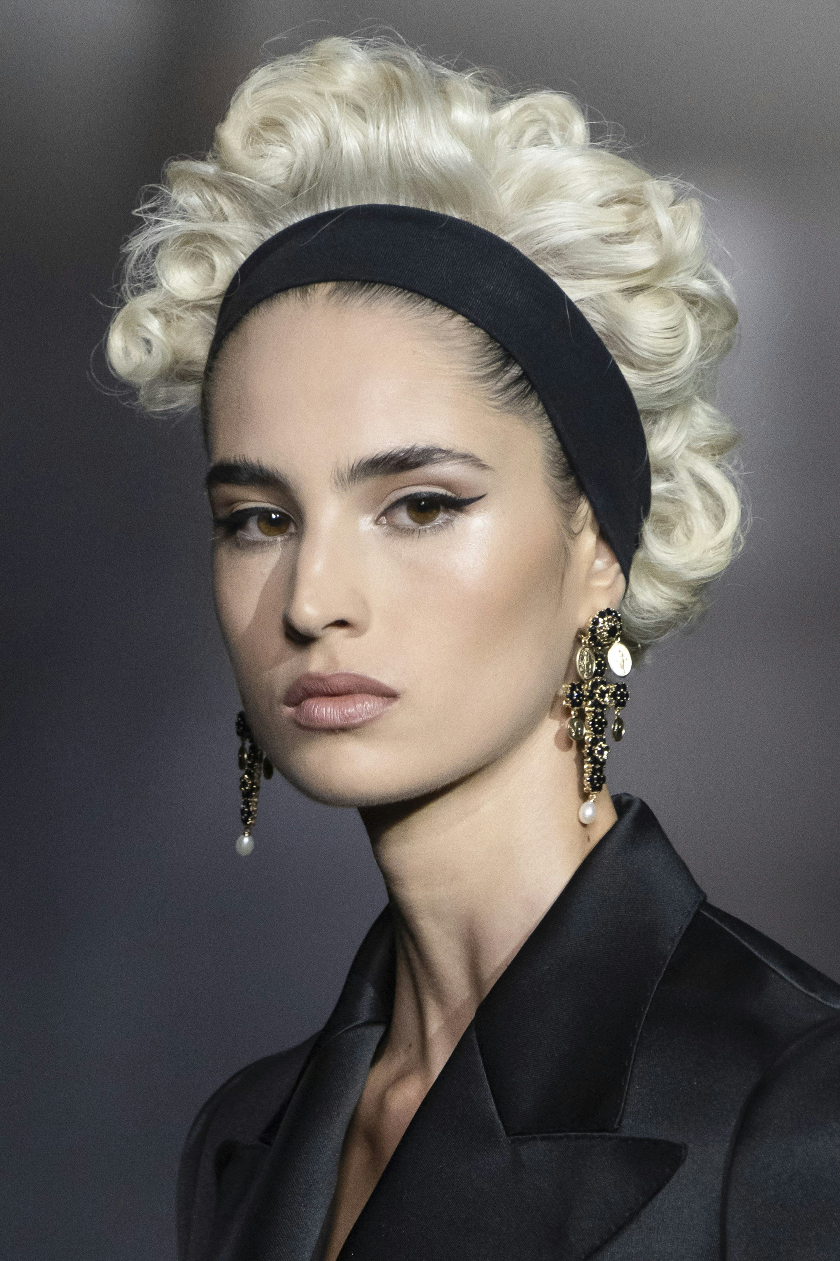 Platinum blonde Marilyn Monroe-inspired curls were spotted at Milan Fashion Week S/S 2025.