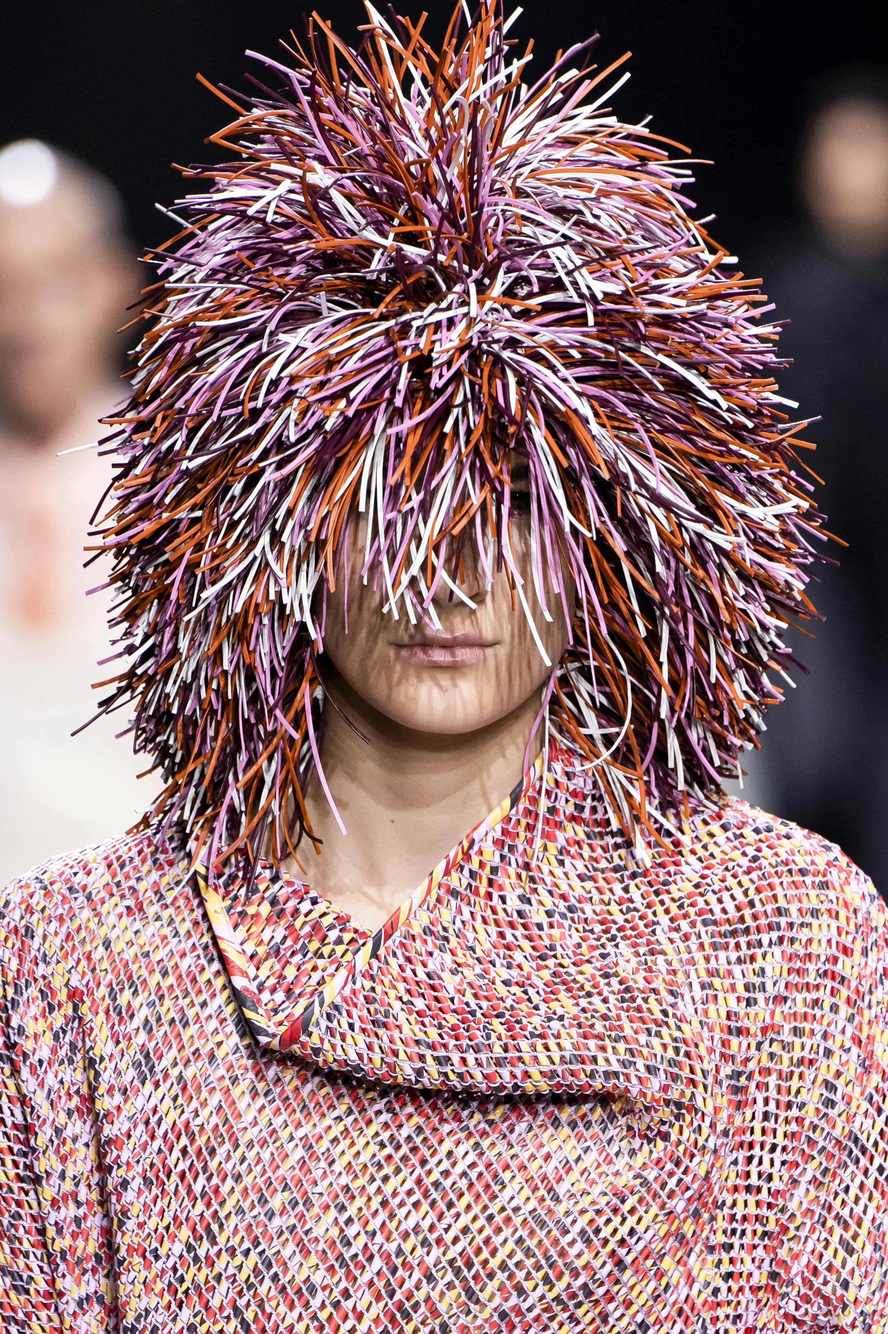 Colorful lion&rsquo;s mane-esque wigs were spotted at Milan Fashion Week S/S 2025.
