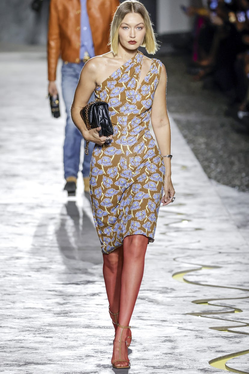 Gigi Hadid walks the runway during the Versace Ready to Wear Spring/Summer 2025 fashion show as part...