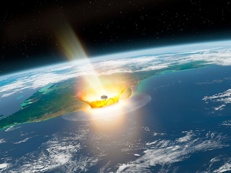 Asteroid impact. Illustration of a large asteroid colliding with Earth on the Yucatan Peninsula in M...