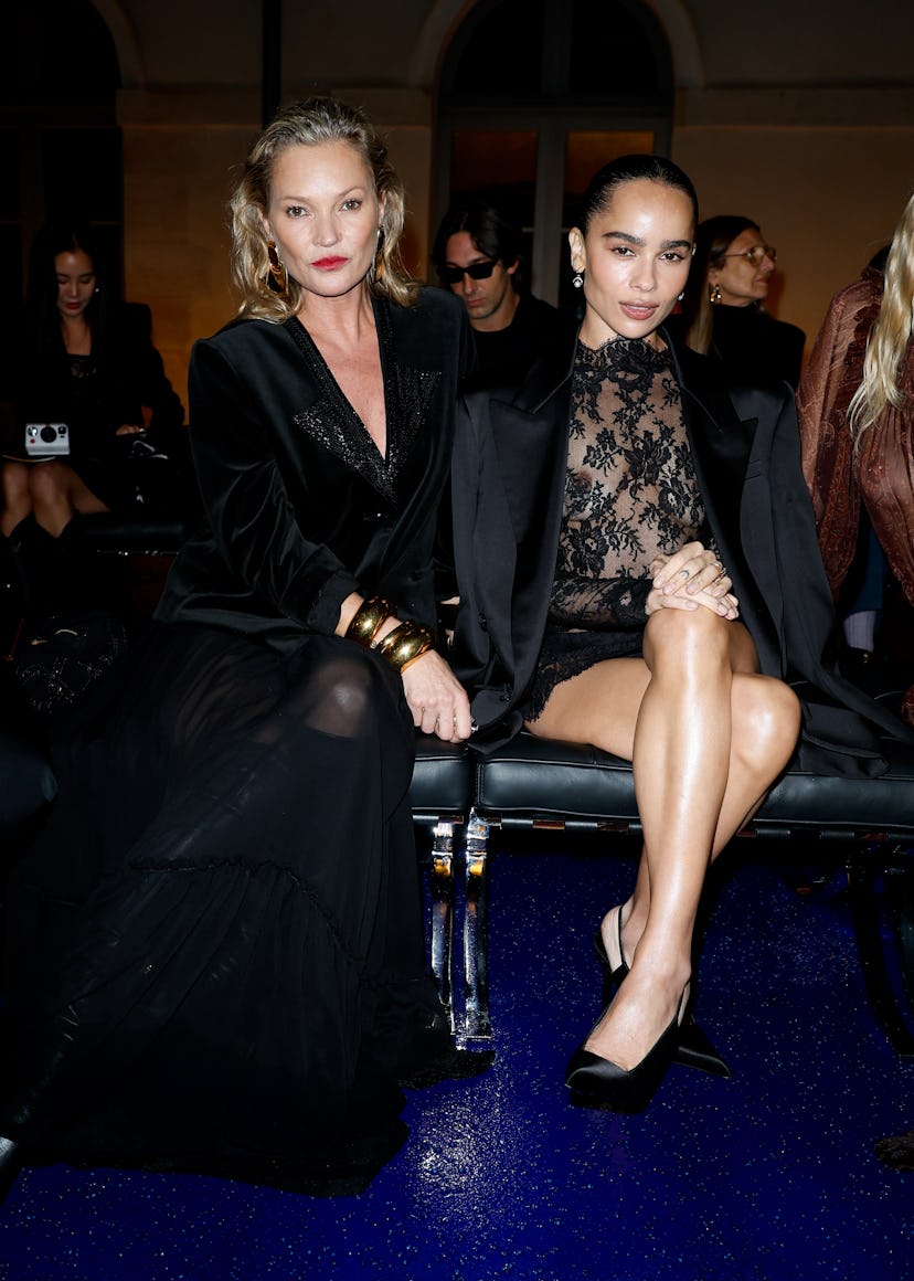 Kate Moss and Zoë Kravitz at Saint Laurent RTW Spring 2025 as part of Paris Ready to Wear Fashion We...