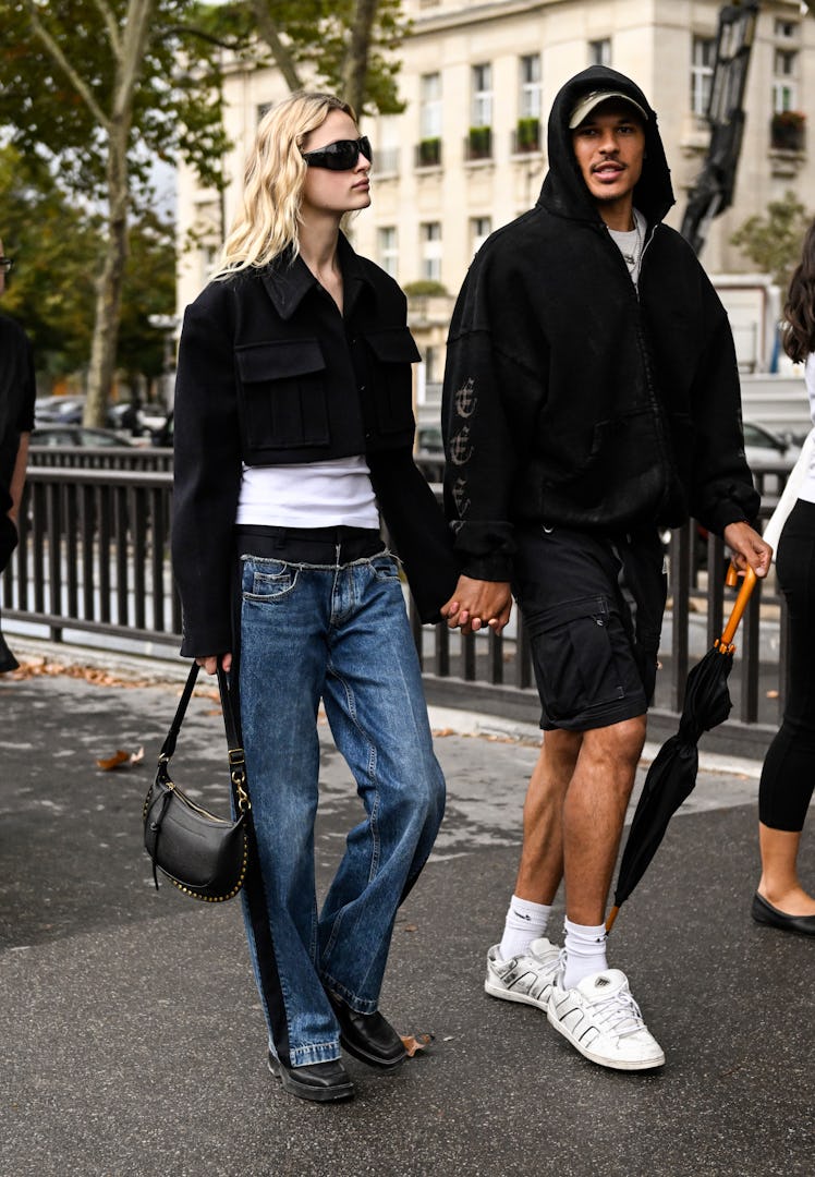 PARIS, FRANCE - OCTOBER 03: Felice Nova is seen wearing a black jacket, white shirt, blue and black ...