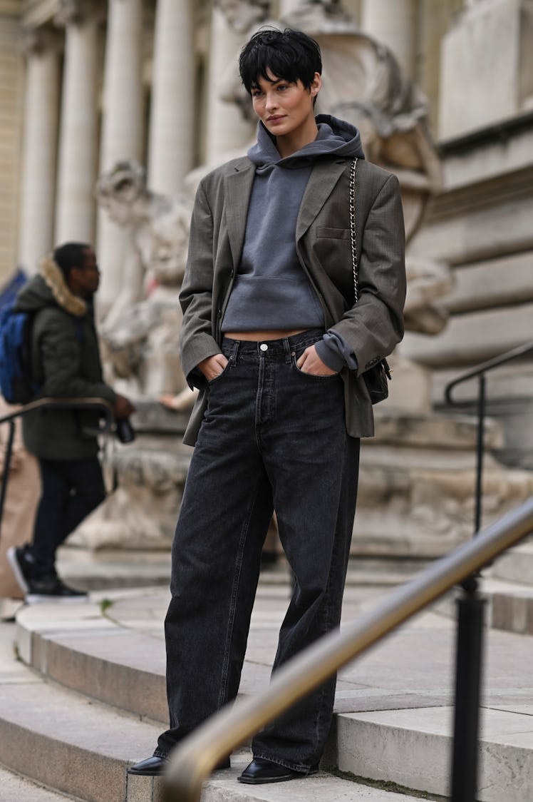 PARIS, FRANCE - OCTOBER 03: Model Grace Elizabeth is seen wearing a gray hoodie, gray jacket and bla...