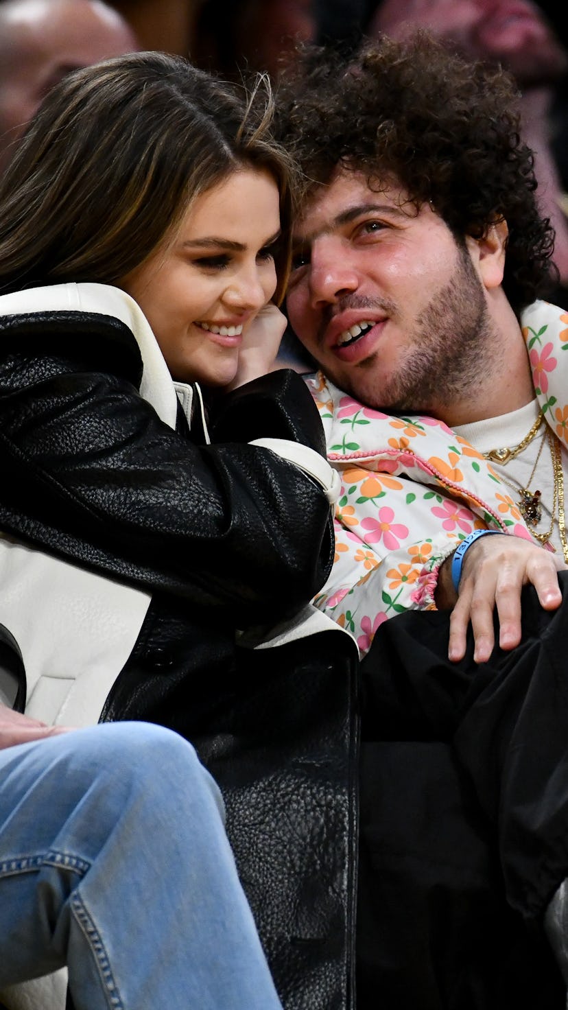 LOS ANGELES, CALIFORNIA - JANUARY 03: Selena Gomez and Benny Blanco attend a basketball game between...