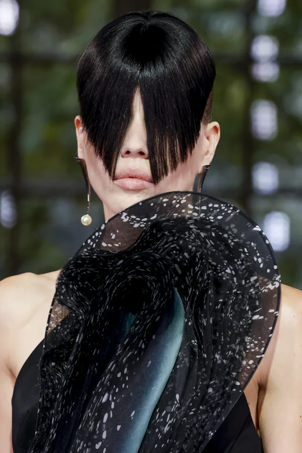 Edgy cut-out bangs were spotted at Paris Fashion Week Spring/Summer 2025.