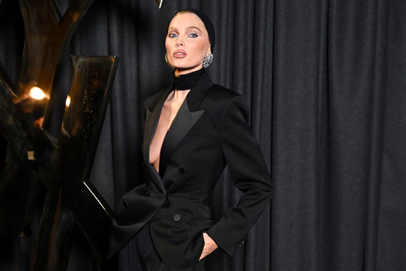 Elsa Hosk wore a plunging black blazer at Paris Fashion Week at the Saint Laurent Spring/Summer 2025…