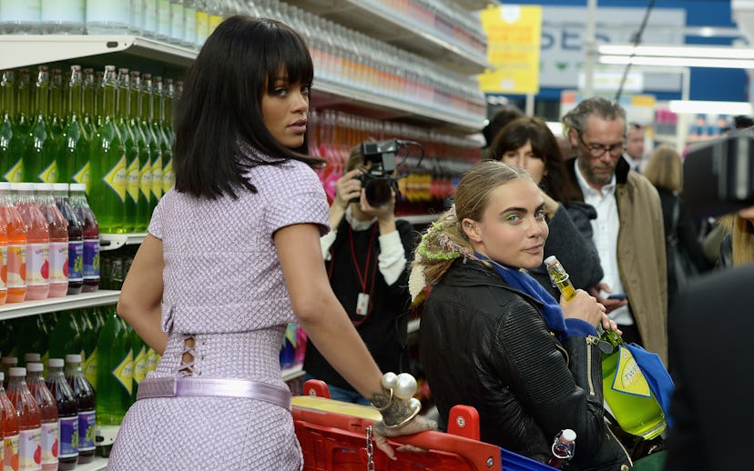 PARIS, FRANCE - MARCH 04:  (L-R) Rihanna and Cara Delevigne attend the Chanel show as part of the Pa...