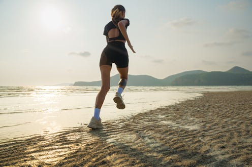 woman running at the beach