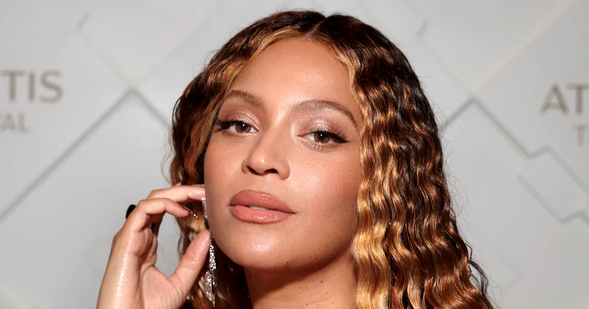 Beyoncé Wore A Plunging Gold Dress At SirDavis Launch Party