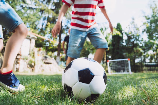 Kids playing an informal game of soccer. Residents in a small neighborhood say that their HOA is dem...