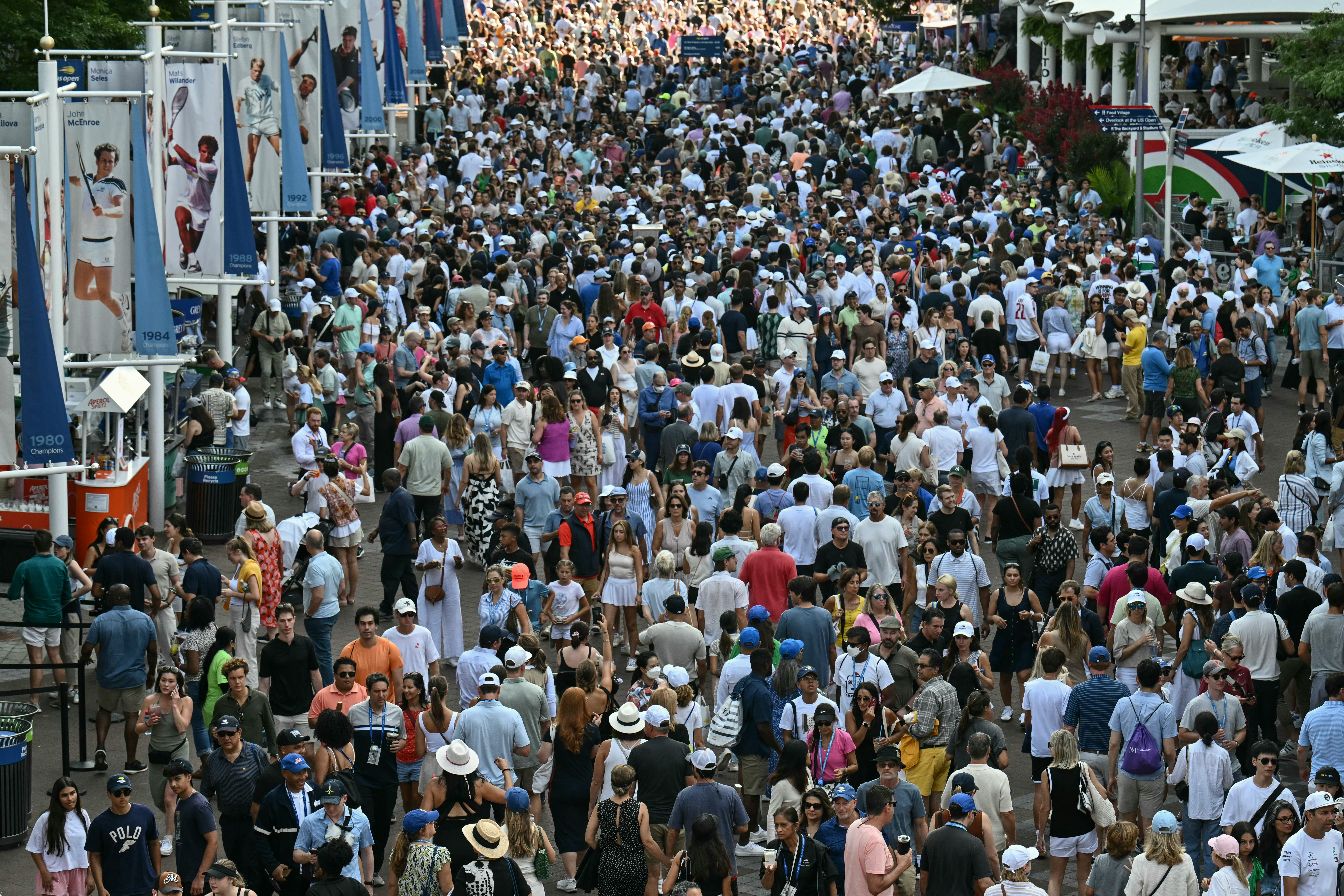 Fans walk along the concourse outside of Arthur Ashe Stadium on day six of the US Open tennis tourna&hellip;