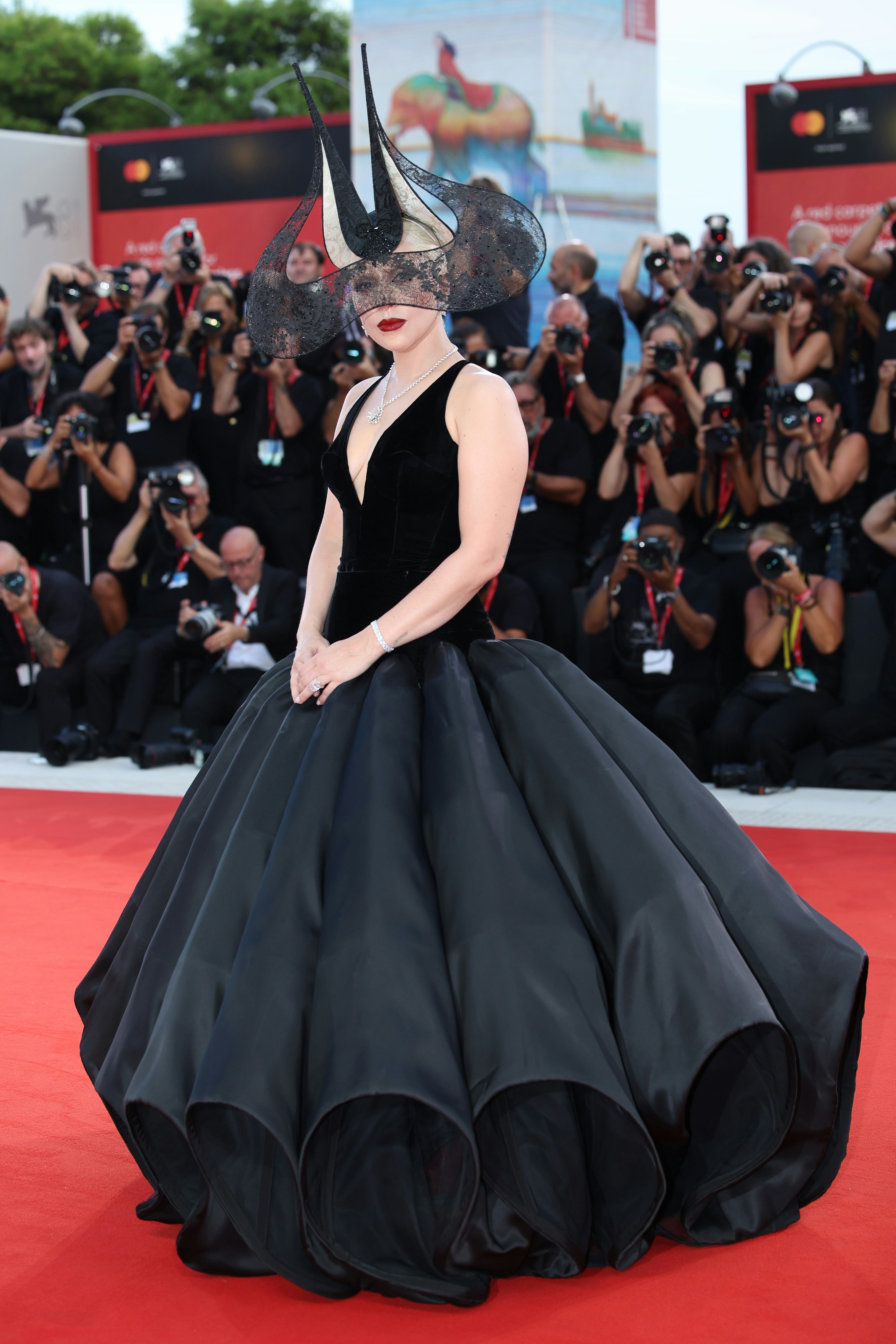 Lady Gaga&rsquo;s plunging gown and headpiece on the &ldquo;Joker: Folie à Deux&rdquo; red carpet