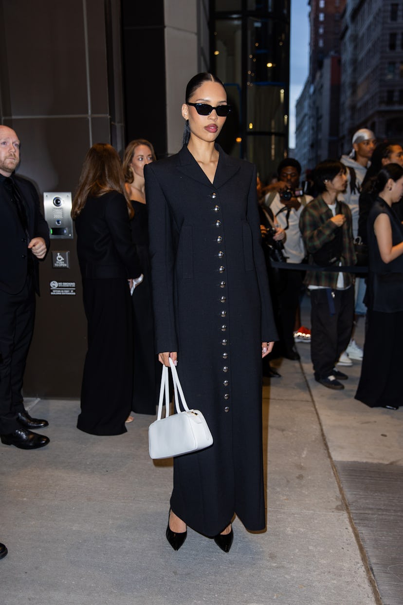 NEW YORK, NEW YORK - SEPTEMBER 07: A guest wears black coat outside Khaite New York Fashion Week on ...