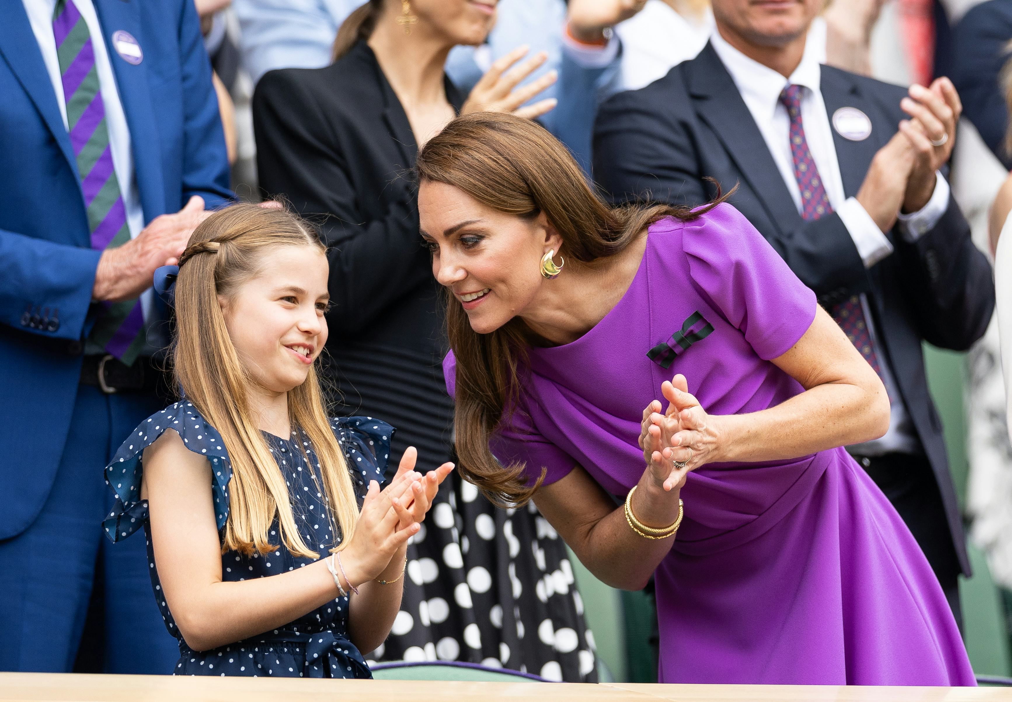 Catherine, Princess of Wales talks with Princess Charlotte of Wales at Wimbledon