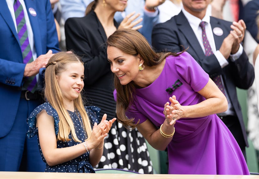 Catherine, Princess of Wales talks with Princess Charlotte of Wales at Wimbledon