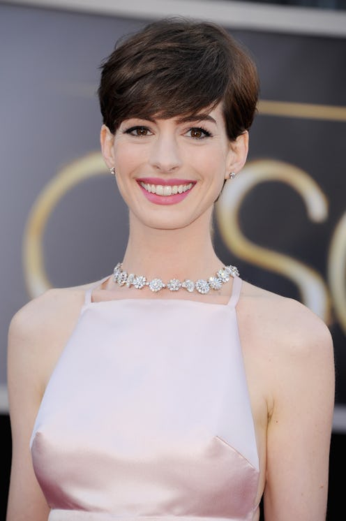 HOLLYWOOD, CA - FEBRUARY 24: Actress Anne Hathaway, wearing Giorgio Armani, arrives at the Oscars a...