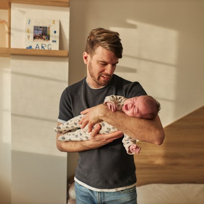 Father is taking care of newborn baby. One in 10 new fathers screen positive for post-natal depression.