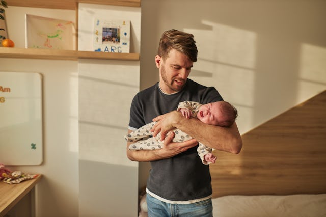 Father is taking care of newborn baby. One in 10 new fathers screen positive for post-natal depressi...