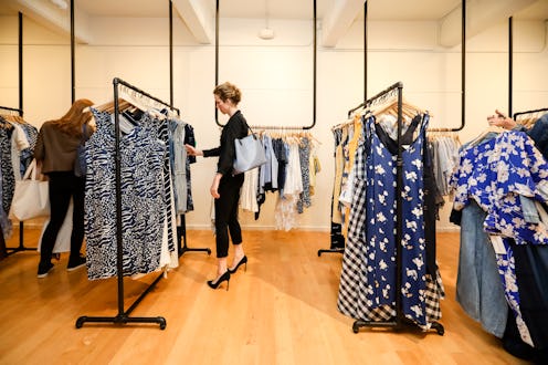 Shoppers look through racks during the launch of Rent the Runway's West Coast flagship store on May ...