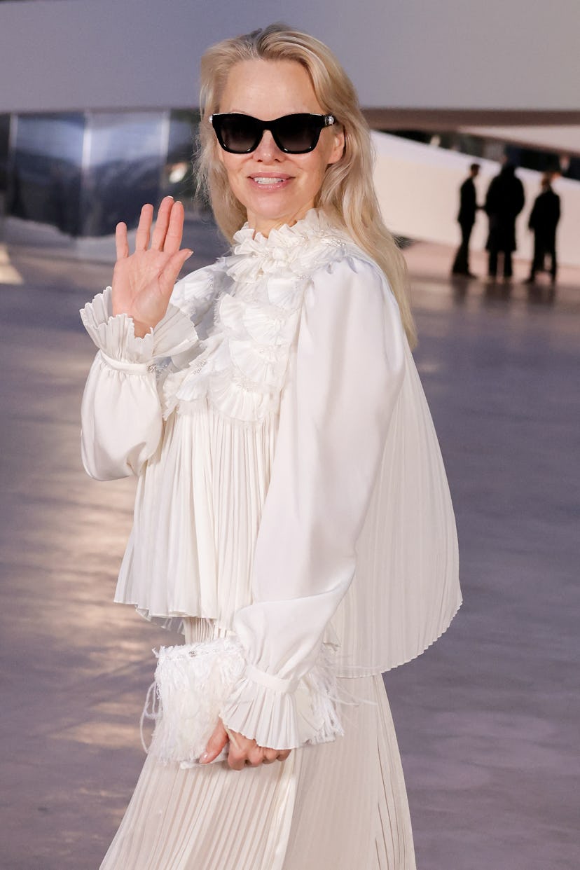 US actress Pamela Anderson poses during a photocall ahead of the Chanel Women's Haute-Couture Spring...
