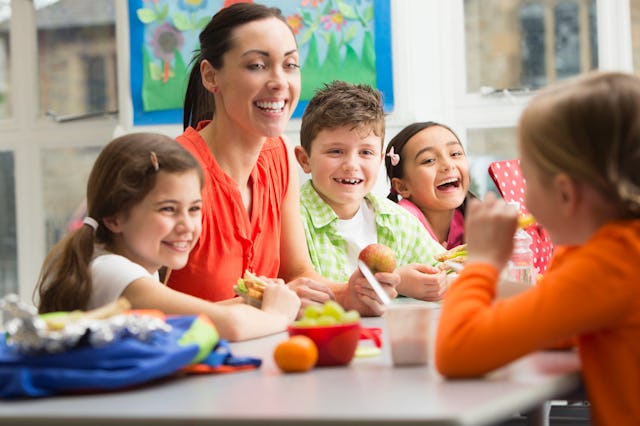 A group of students each lunch with their teacher. A new study shows that story-telling can impact k...