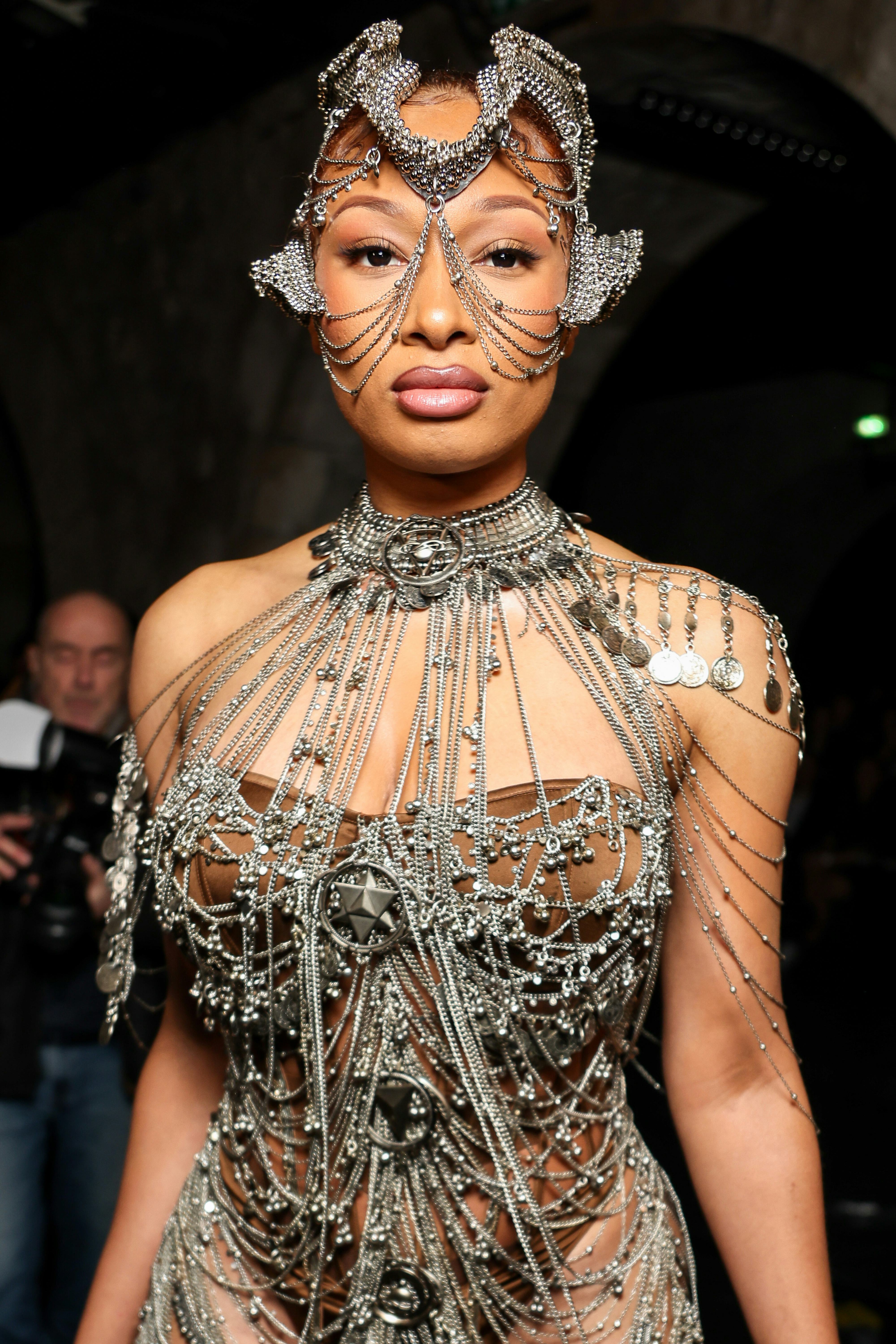 Megan Thee Stallion basically wore body jewelry to Paris Couture Week.