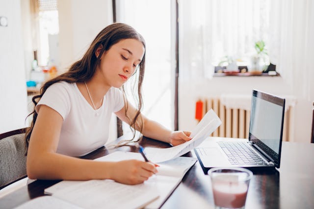 Teenager girl studying at home. California high school students spend an average of 2.5 hours on hom...